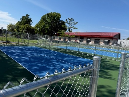 Reconstructed blue pickleball courts at Cook Park in Rochester Minnesota