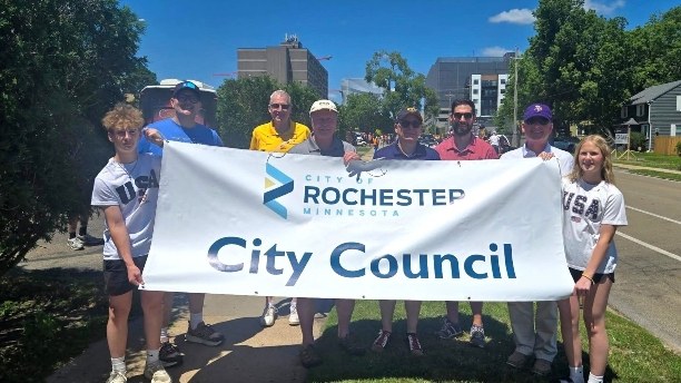 Rochester City Council members carrying a City Council banner in the Rochesterfest Parade